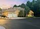Charming home featuring a three-car garage, a well-manicured lawn, and inviting curb appeal at 7246 Gaberia Rd, New Port Richey, FL 34655