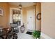 Front porch with table, chair, and potted plants at 7246 Gaberia Rd, New Port Richey, FL 34655