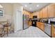 Well-equipped kitchen with stainless steel appliances, black countertops and ample cabinet space at 7246 Gaberia Rd, New Port Richey, FL 34655
