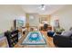 Cozy living room with a ceiling fan, hardwood floors, and a comfortable seating area at 7246 Gaberia Rd, New Port Richey, FL 34655