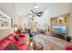 Bright and airy living room with hardwood floors, high ceilings, skylights, and comfortable seating at 7246 Gaberia Rd, New Port Richey, FL 34655