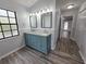Bathroom featuring a double vanity and updated fixtures with lots of storage at 7278 Radcliff St, Spring Hill, FL 34606