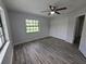 Bedroom featuring wood floors, a window and closet at 7278 Radcliff St, Spring Hill, FL 34606
