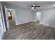 Cozy bedroom has new floors, neutral paint, and easy access to kitchen and closets at 7278 Radcliff St, Spring Hill, FL 34606