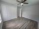 Bedroom featuring wood floors, a window and closet at 7278 Radcliff St, Spring Hill, FL 34606