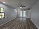 Bedroom with updated flooring, natural light and glass doors to the pool at 7278 Radcliff St, Spring Hill, FL 34606