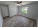Bedroom featuring updated flooring, neutral paint, large closet and a ceiling fan at 7278 Radcliff St, Spring Hill, FL 34606
