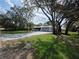 Attractive single-story home with long driveway, lush front lawn and mature landscaping at 7278 Radcliff St, Spring Hill, FL 34606