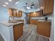 Kitchen showcasing modern wooden cabinets, stainless steel appliances, island and granite counters at 7278 Radcliff St, Spring Hill, FL 34606