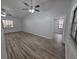 Open living room with hardwood floors and vaulted ceilings at 7278 Radcliff St, Spring Hill, FL 34606