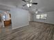 Spacious open-plan living room seamlessly integrated with the bright modern kitchen at 7278 Radcliff St, Spring Hill, FL 34606