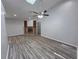 Inviting living room with vaulted ceilings, modern flooring, and a cozy fireplace at 7278 Radcliff St, Spring Hill, FL 34606