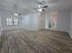 Bright, open-concept living room boasts updated flooring and plenty of natural light at 7278 Radcliff St, Spring Hill, FL 34606