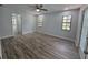 Spacious main bedroom features new floors, natural light, and a door to the outside at 7278 Radcliff St, Spring Hill, FL 34606