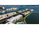 Breathtaking aerial view of waterfront condos with a community pool and boat docks, nestled amidst beautiful waterways at 7465 Bay Island S Dr # 213, South Pasadena, FL 33707