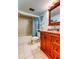 Bathroom with granite counters, modern fixtures, and a tiled shower/tub at 7465 Bay Island S Dr # 213, South Pasadena, FL 33707