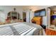 Inviting bedroom with light hardwood floors and natural light, and furniture at 7465 Bay Island S Dr # 213, South Pasadena, FL 33707