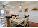 Bright dining space boasts stylish table, seating for six, and views into the inviting living area at 7465 Bay Island S Dr # 213, South Pasadena, FL 33707