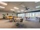 Spacious game room featuring multiple tables, chairs, and large windows for natural light at 7465 Bay Island S Dr # 213, South Pasadena, FL 33707