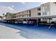 Covered parking area featuring multiple parking spaces available at the multi-story residential building at 7465 Bay Island S Dr # 213, South Pasadena, FL 33707