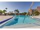 Sparkling community pool offers a refreshing escape, surrounded by lush landscaping at 7465 Bay Island S Dr # 213, South Pasadena, FL 33707