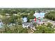 Aerial view of home featuring a two-car garage and waterfront access at 8203 Kirkwood Dr, Tampa, FL 33634