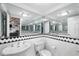 Bathroom featuring a unique sink, updated toilet and decorative tile at 8203 Kirkwood Dr, Tampa, FL 33634