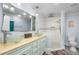 Bathroom with dual glass vessel sinks, a walk-in shower, and sleek fixtures at 8203 Kirkwood Dr, Tampa, FL 33634