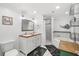 Bright bathroom with double sinks, bathtub, and a separate shower stall at 8203 Kirkwood Dr, Tampa, FL 33634