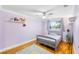 Bedroom featuring hardwood floors and light purple walls at 8203 Kirkwood Dr, Tampa, FL 33634