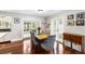 Bright dining room with wood floors, table with seating for six, and views of the outdoor pool at 8203 Kirkwood Dr, Tampa, FL 33634