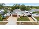 Charming two-story home with a well-manicured lawn and a two car garage at 8203 Kirkwood Dr, Tampa, FL 33634