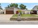 Charming single-Gathering home with a well-manicured lawn and beautiful landscaping at 8203 Kirkwood Dr, Tampa, FL 33634
