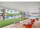 Cozy screened-in patio with lake views and a well manicured lawn at 8203 Kirkwood Dr, Tampa, FL 33634