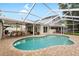 Inviting screened-in pool with outdoor dining and patio area, perfect for entertaining and relaxation at 8203 Kirkwood Dr, Tampa, FL 33634