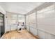 Bright sunroom with wood floors, large windows, and exercise equipment at 8203 Kirkwood Dr, Tampa, FL 33634