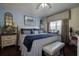 Comfortable bedroom with blue accents, natural light and decorative furniture at 8447 Shallow Creek Ct, New Port Richey, FL 34653