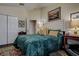 Cozy bedroom with a comfortable bed, a ceiling fan, and ample closet space at 8447 Shallow Creek Ct, New Port Richey, FL 34653