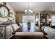 Bright dining area featuring a wooden table, stylish lighting, and chic decor, perfect for entertaining and enjoying meals at 8447 Shallow Creek Ct, New Port Richey, FL 34653