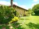Charming backyard with lush greenery and stone walkway accentuating the home's natural setting at 9313 Lisbon St, Seffner, FL 33584