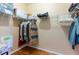 Organized walk-in closet with shelving and ample storage space for clothes and accessories at 9313 Lisbon St, Seffner, FL 33584