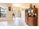 Bright foyer with decorative tile, high ceilings, and natural light streaming through glass front doors at 9313 Lisbon St, Seffner, FL 33584