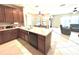 Kitchen featuring a large island, custom cabinets, stainless steel dishwasher, and an open design at 9313 Lisbon St, Seffner, FL 33584