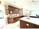 Stylish kitchen showcasing wood cabinets, a large island, and an open layout perfect for entertaining at 9313 Lisbon St, Seffner, FL 33584