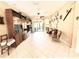 Living room features a built-in bookcase, tile flooring, and comfortable seating near sliding glass doors at 9313 Lisbon St, Seffner, FL 33584