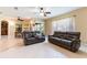 Open-concept living room with comfortable seating, tile flooring, and natural light at 9313 Lisbon St, Seffner, FL 33584