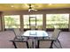 Inviting screened patio features a dining table with scenic outdoor views at 9313 Lisbon St, Seffner, FL 33584
