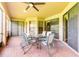 Relaxing covered patio with brick flooring and an outdoor dining area at 9313 Lisbon St, Seffner, FL 33584