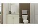 Neutral bathroom with a white vanity, granite countertop, toilet, and tiled glass door shower at 9376 Gladsome Dr, Land O Lakes, FL 34637
