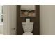 This cozy powder room offers a space-saving pedestal sink and classic toilet with modern decorative wall art at 9376 Gladsome Dr, Land O Lakes, FL 34637